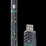 Green and black cannabis vape pen with a USB charger.