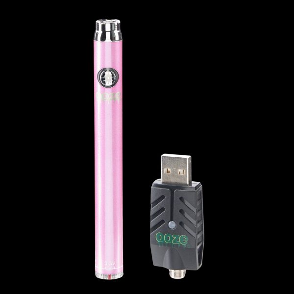 Pink cannabis vape pen and USB charger.