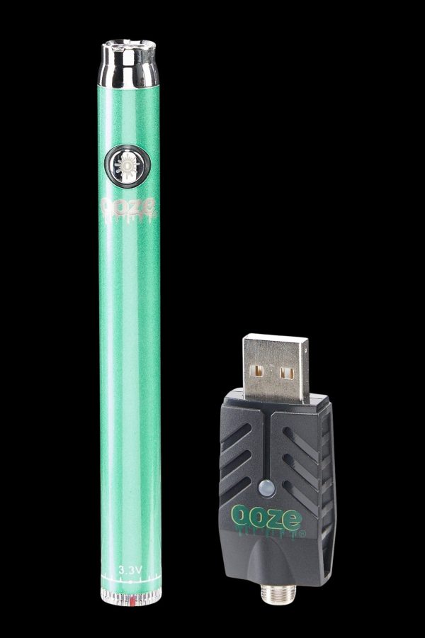 Green cannabis vape pen and USB charging case.