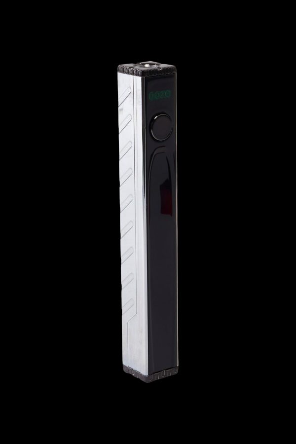 Sleek black and white cannabis vaporizer pen with digital display.
