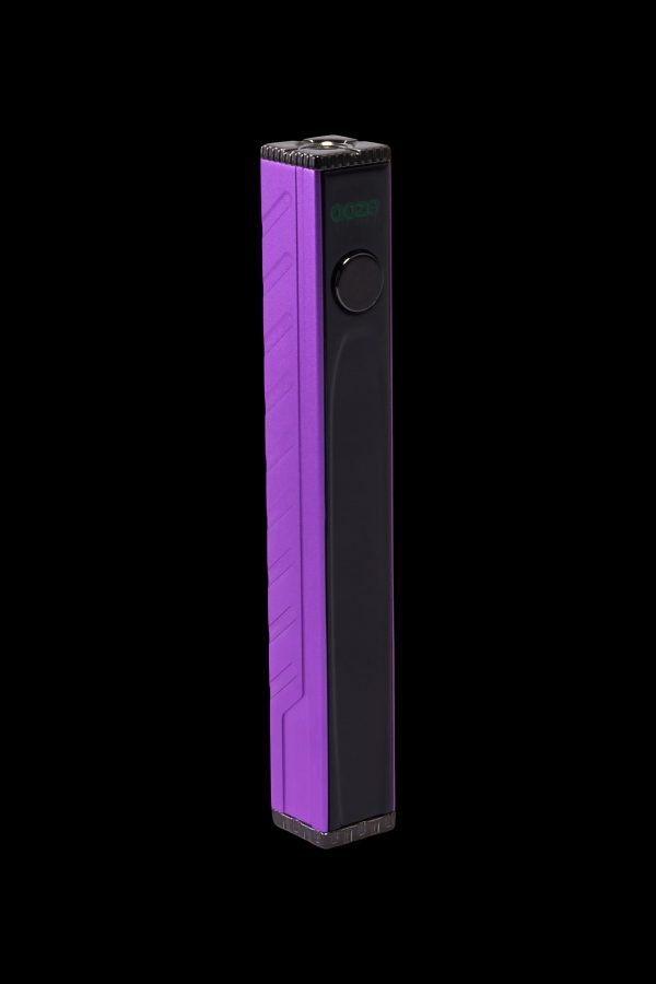 Purple and black electronic vaporizer pen isolated on a black background.