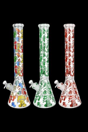 Three glass bongs with colorful mushroom designs against a black background.