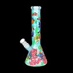 A colorful glass water pipe decorated with an underwater scene of coral and fish.