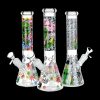 Three decorated glass bongs with cannabis leaf and alien designs against a black background.