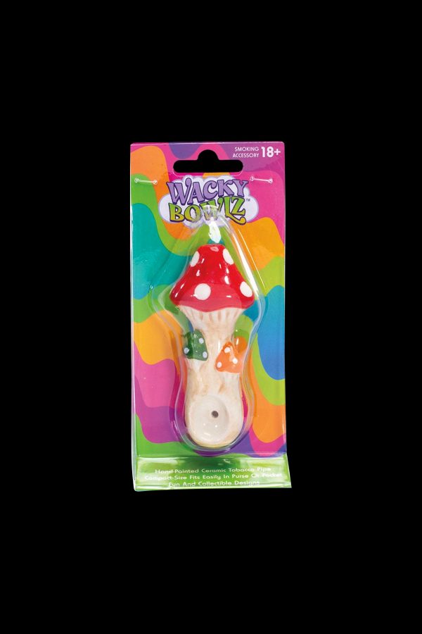 A plastic-packaged ceramic mushroom-shaped smoking bowl with a colorful, glazed finish, labeled "Wacky Bowlz" with an 18+ warning.