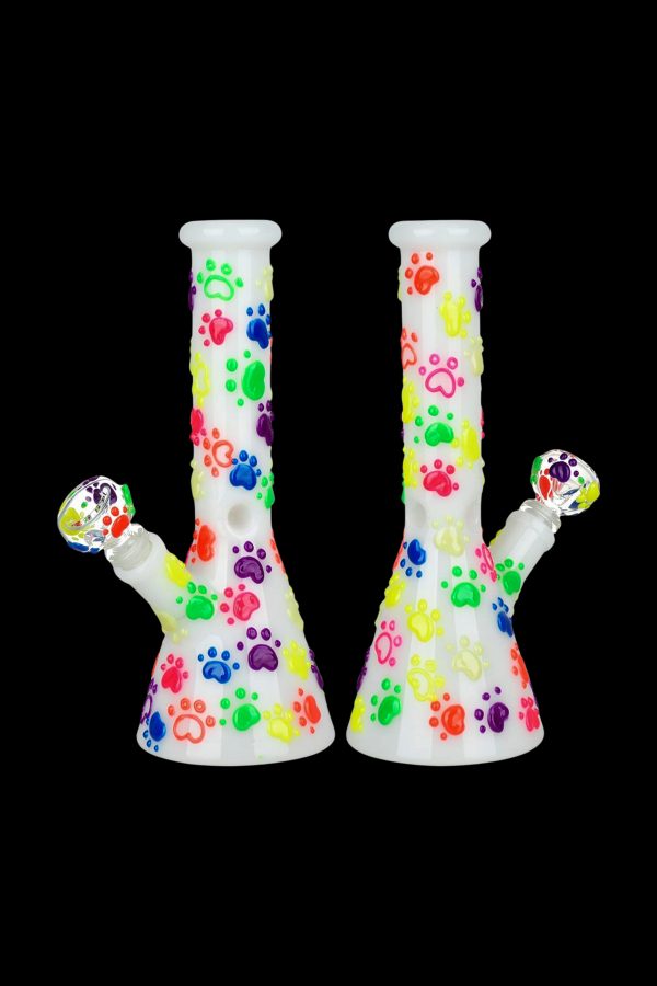 Two colorful glass bongs with patterned designs against a black background.