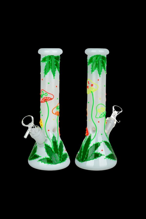Two glass bongs with cannabis leaf designs against a black background.