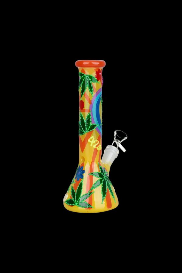 Colorful glass bong with cannabis leaf designs against a black background.