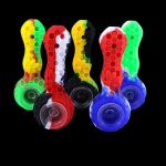 Colorful silicone smoking pipes arranged against a black background.