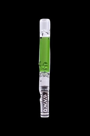Glass cannabis oil rig with green accents and a skull design, isolated on a black background.