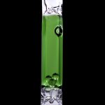 Green cannabis oil filling a glass pipe against a black background.