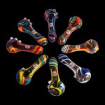 Colorful glass smoking pipes arranged in a radial pattern on a black background.