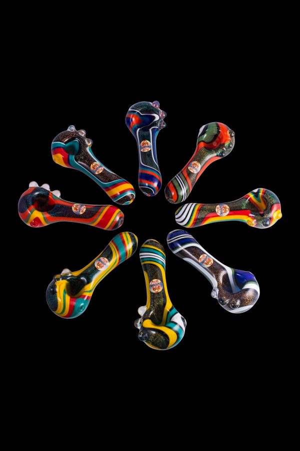 Colorful glass smoking pipes arranged in a radial pattern on a black background.
