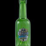 Green glass bottle with a skull-themed "Crush Glassworks" label, established in 1996.
