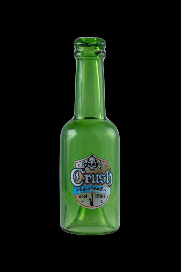 Green glass bottle with a skull-themed "Crush Glassworks" label, established in 1996.
