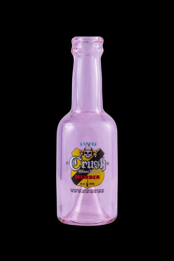 Pink glass bottle with “Crush Glass” branding and skull graphic, likely for cannabis concentrates.
