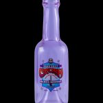 Purple glass bottle with a colorful "Crash Glassworks" label, likely for cannabis concentrates.