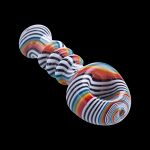 Colorful glass pipe with swirling stripes against a black background.