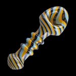 Hand-blown glass dab rig with blue, yellow, and black stripes.