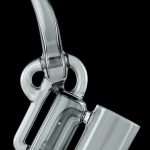 Clear glass rig for vaporizing concentrates, with a bubbler and angled mouthpiece.