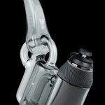 A translucent gray cannabis water pipe (rig) and electronic vaporizer (e-nail) set against a black background.