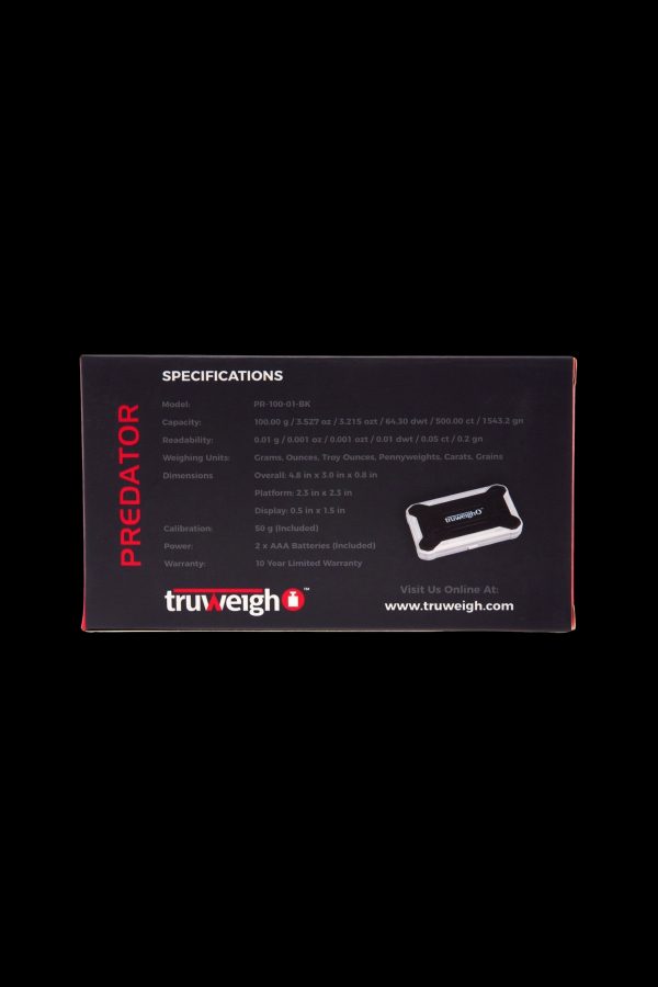 Close-up of a black Truweigh Predator scale's specifications card, listing capacity, readability, dimensions, calibration, and warranty details, alongside a product image of the scale itself.