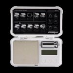 Digital scale with an open lid, displaying a quick start guide and unit conversions, commonly used for measuring cannabis.