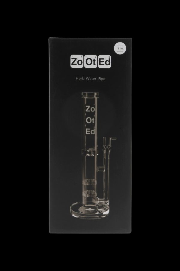 Clear acrylic water pipe in retail packaging labeled “ZoOt Ed” and “Herb Water Pipe.”