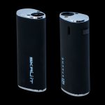 Two black Skruut and Stache cannabis vaporizers on a dark background.