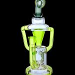 A vibrant green glass dab rig with intricate curves and a percolator, isolated on a black background.