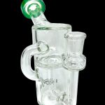 Clear glass bubbler with green mouthpiece, featuring intricate glasswork and a side-mounted bowl.