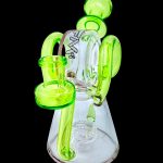 Green glass water pipe with intricate looped design.