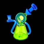 Green and blue glass water pipe (rig) isolated on a black background.