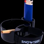 Black ashtray with a partially smoked joint and a blue lighter, branded with “SNOWTREE”.
