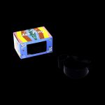 Black cannabis ashtray with a colorful branded box.