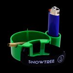 Green cannabis smoking tray with a lit lighter and rolled joint.