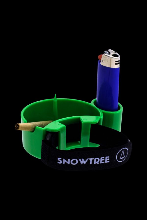 Green cannabis smoking tray with a lit lighter and rolled joint.