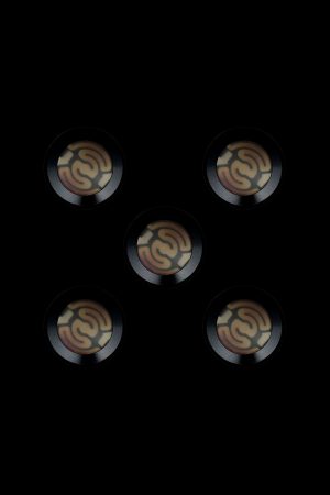 Five metallic cannabis oil cartridge caps with embossed swirling designs against a black background.