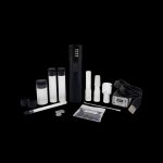 Cannabis oil vape pen kit with cartridges, charging base, and accessories on a black background.