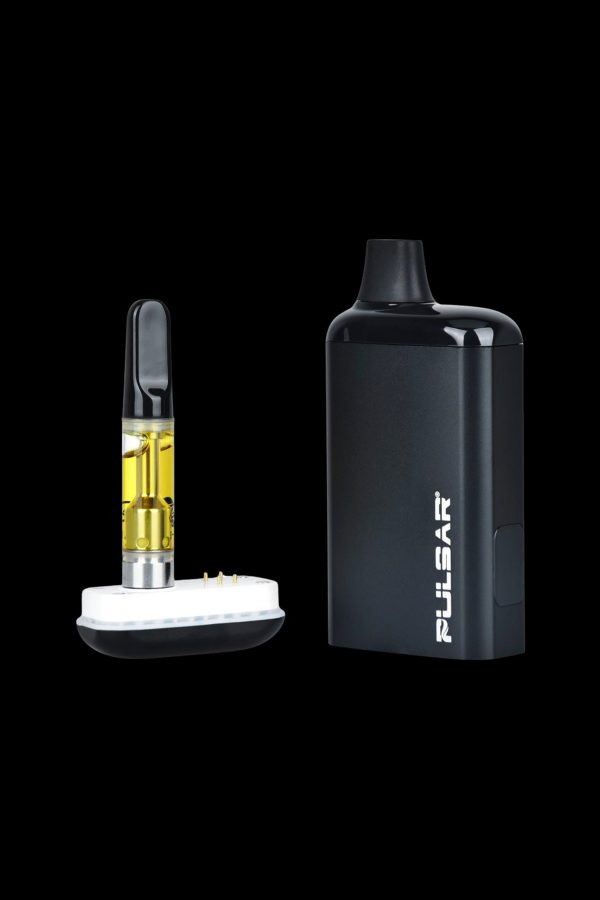 Black cannabis vape pen and cartridge with visible oil.
