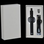 Black cannabis vaporizer pen in open packaging with accessories.