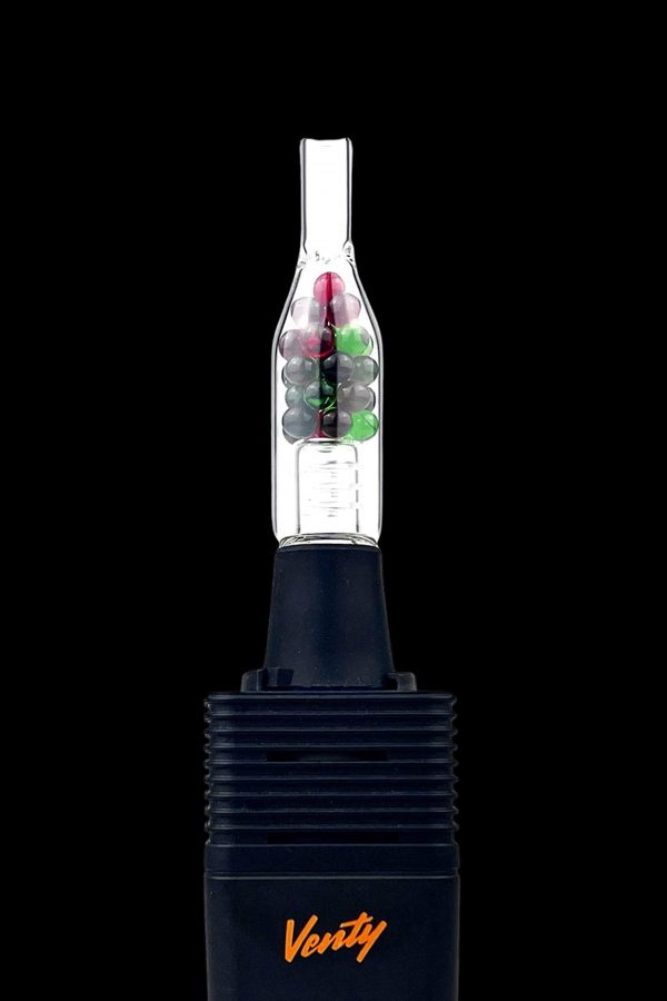 Black cannabis vaporizer with a glass bubbler attachment filled with green and purple cannabis buds. "Verity" is branded on the device.