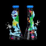 Colorful glass water pipe featuring an alien design, displayed against a black background.