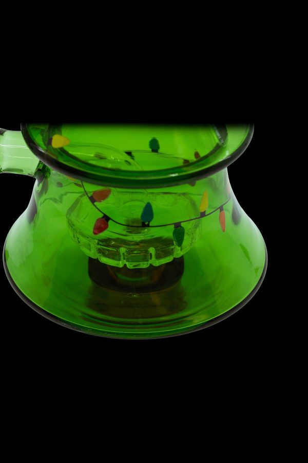 Green glass bubbler with colorful accents, isolated on a black background.