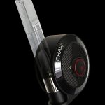 Sleek black and silver cannabis oil vaporizer pen with a clear cartridge, angled against a dark background.