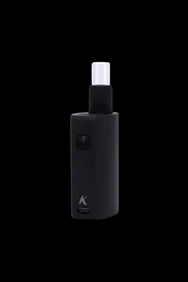 Black cannabis oil vape pen with a magnetic connection.