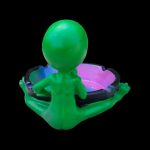 Green alien-shaped ashtray with a purple and black speckled dish.