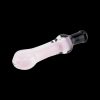 Pink glass pipe for smoking cannabis, isolated on a black background.