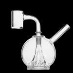 Clear glass dab rig with a quartz banger.