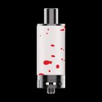 Cannabis oil vaporizer cartridge with a white and red splatter pattern, isolated on a black background.